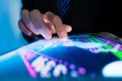 a person using a screen to view statistics