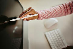 a person using a stylus on a screen