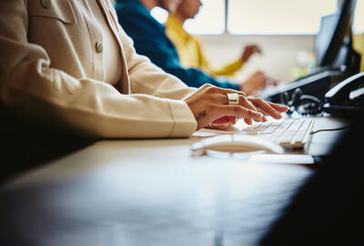 People working on their keyboards