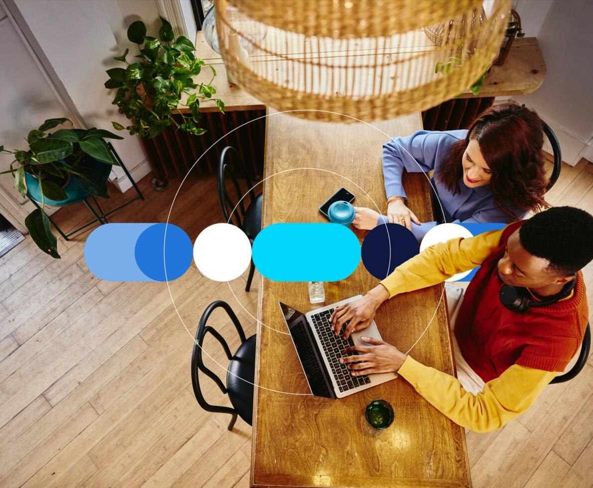 this is a man and a woman using a computer