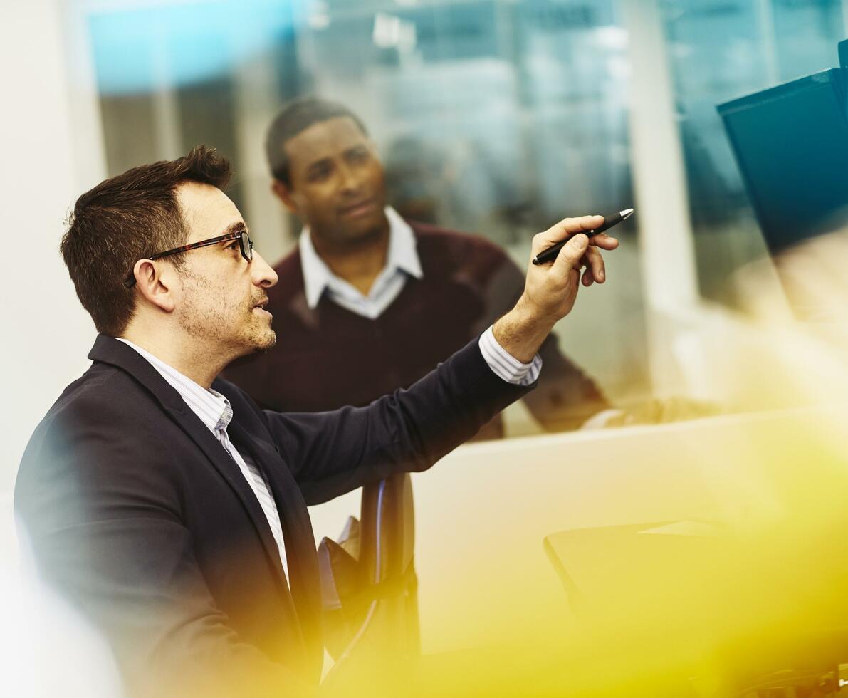 Two men working together in an office