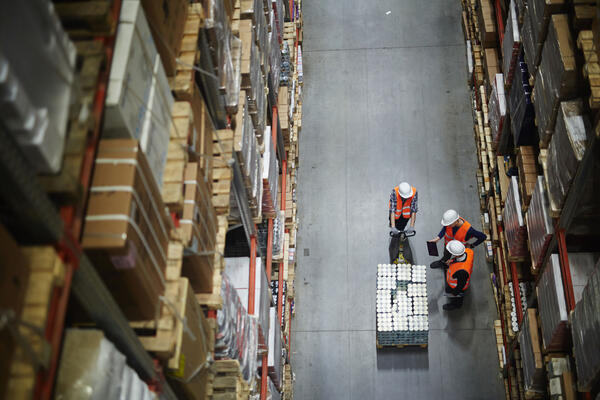 3 people in a warehouse
