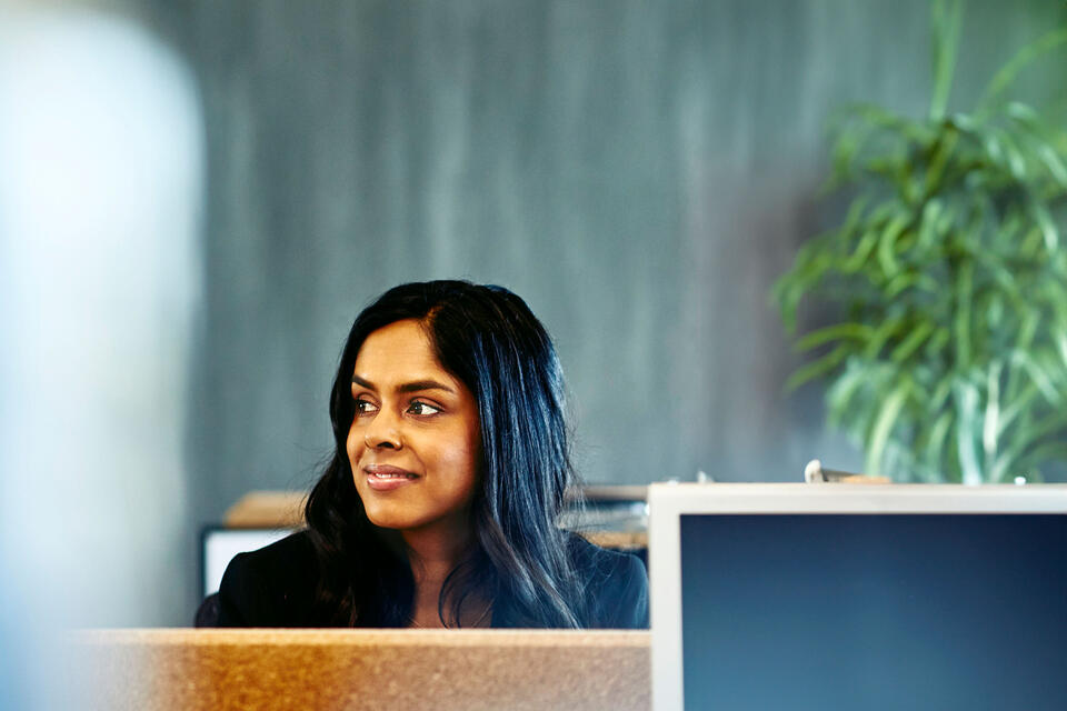 woman sitting on a desk